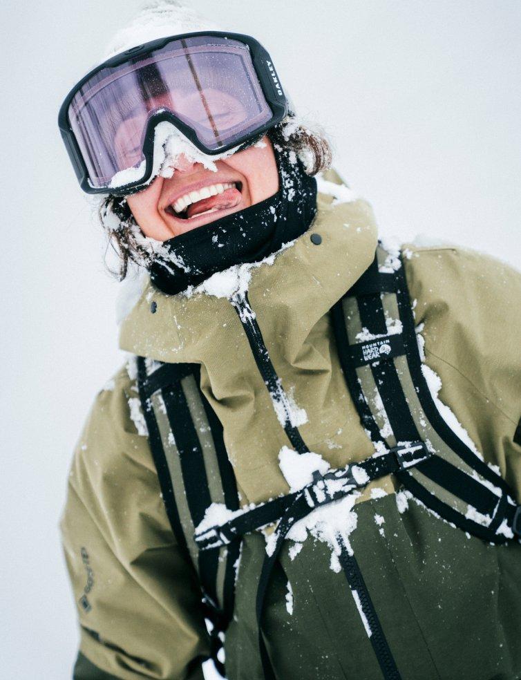 Portrait of a happy skier wearing a FireFall Jacket.